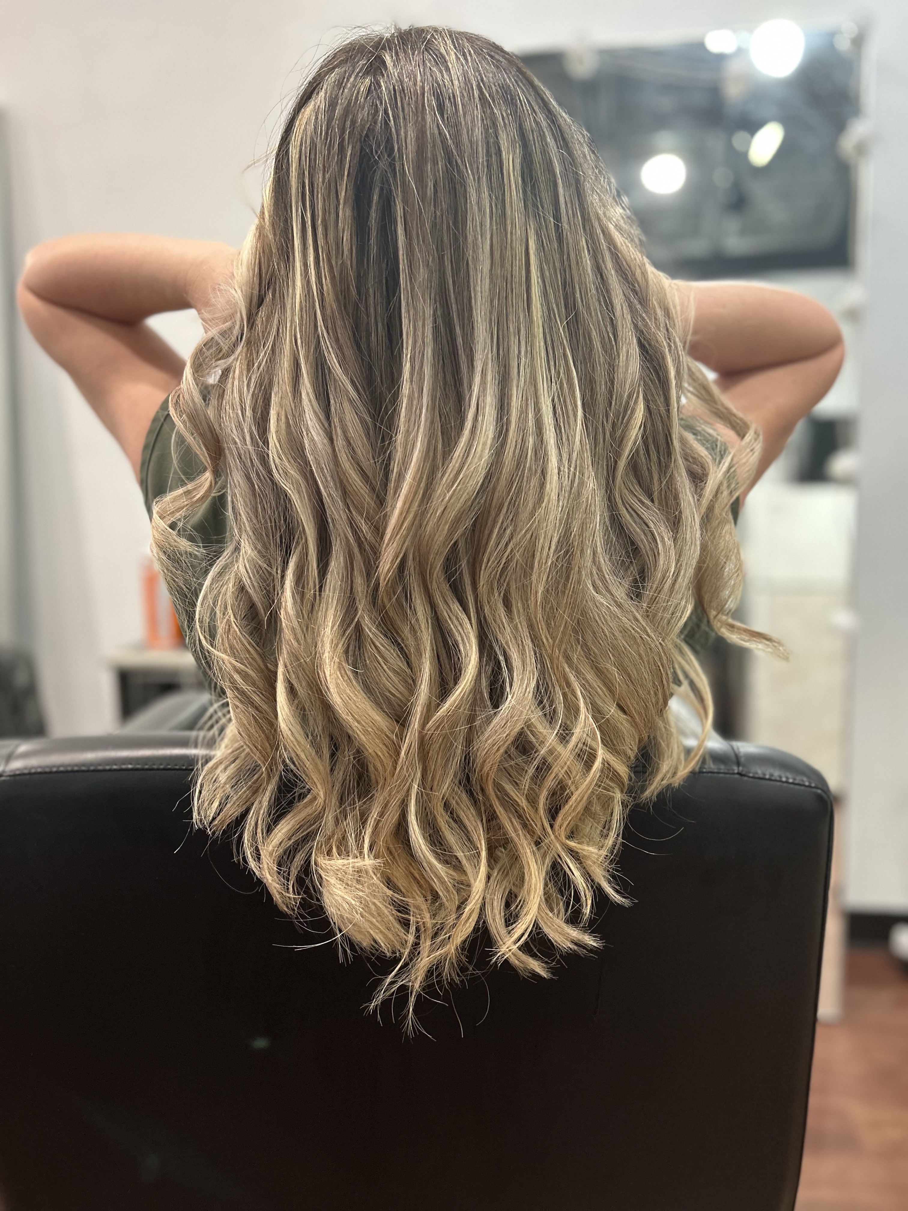 Beachy, just-stepped-off-vacation hair styling result at MaryLuz Hair Salon